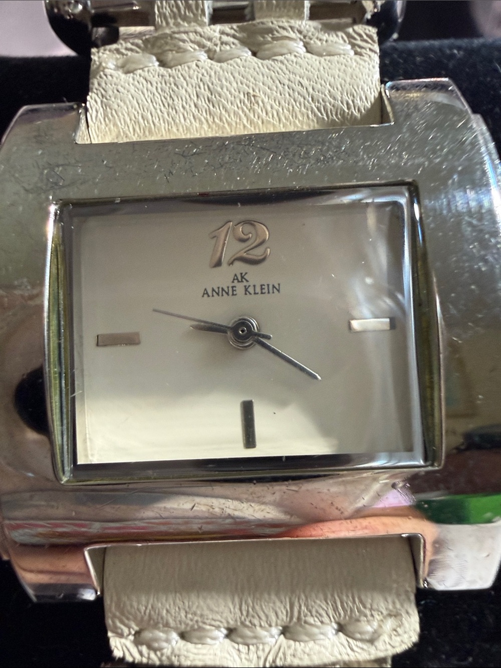 Anne Klein Silver toned Watch with Cream Leather Strap woven into metal accents